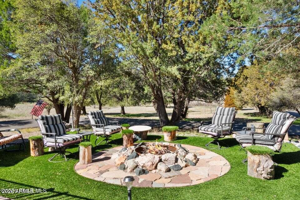 4969 West Iron Springs Road Prescott, AZ 86305 - Photo 6 of 44 a view of a backyard with sitting area