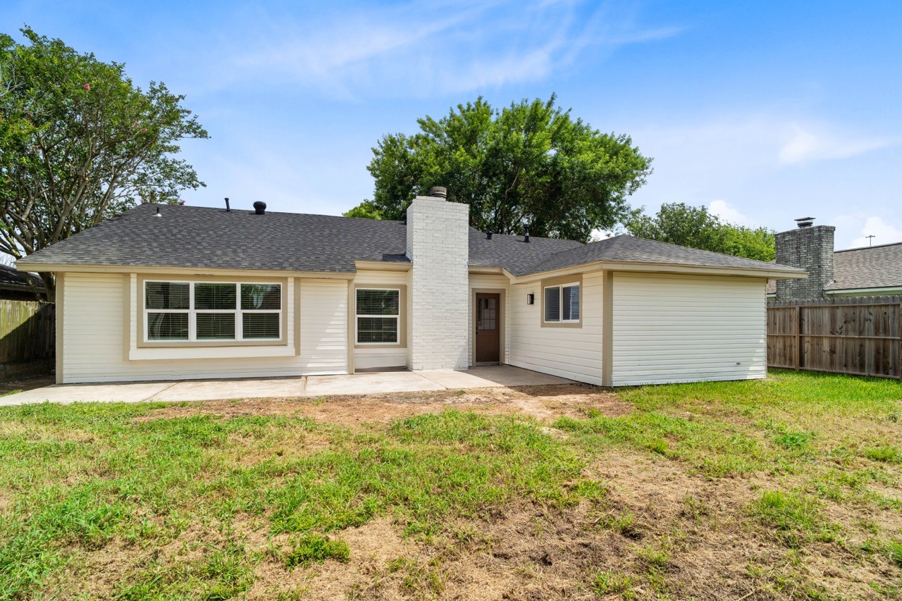 5326 Findlay Drive Pasadena, TX 77505 - Photo 48 of 50 Freshly updated rear exterior showcases new windows, a spacious patio, and a generously sized backyard.