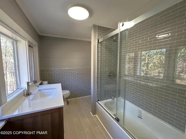 a bathroom with a sink and a bathtub