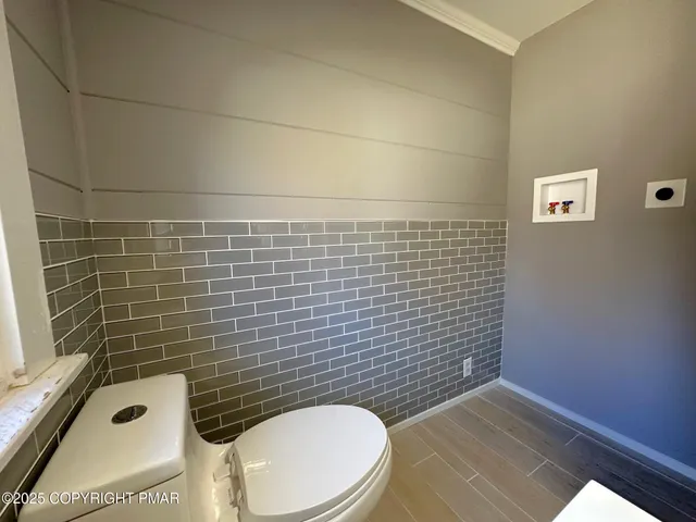 a bathroom with a toilet and a sink