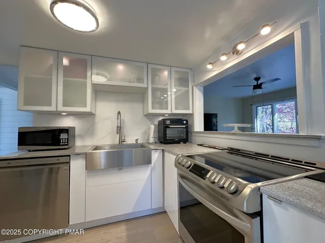 a kitchen with a stove and a sink