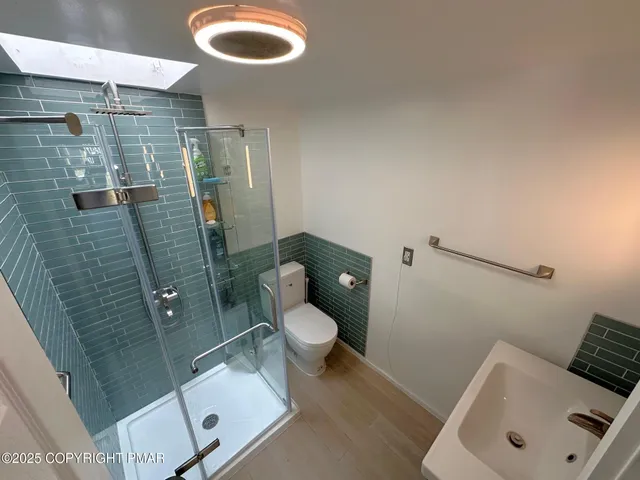 a bathroom with a sink and toilet