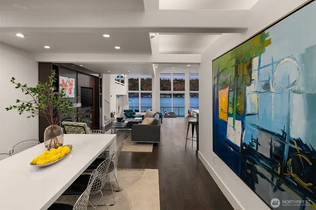 a living room with lots of furniture and kitchen view