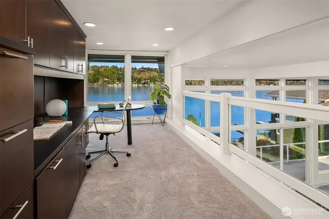 a spacious bedroom with a bed and large window