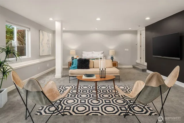 a living room with furniture and a large window