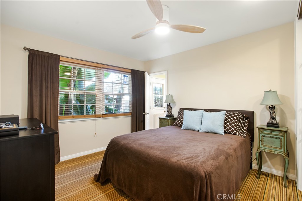 9253 Rose Street Bellflower, CA 90706 - Photo 16 of 36 a bedroom with a bed and a window