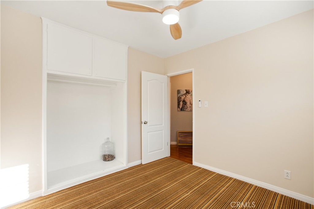 9253 Rose Street Bellflower, CA 90706 - Photo 19 of 36 a view of an empty room with closet and a window