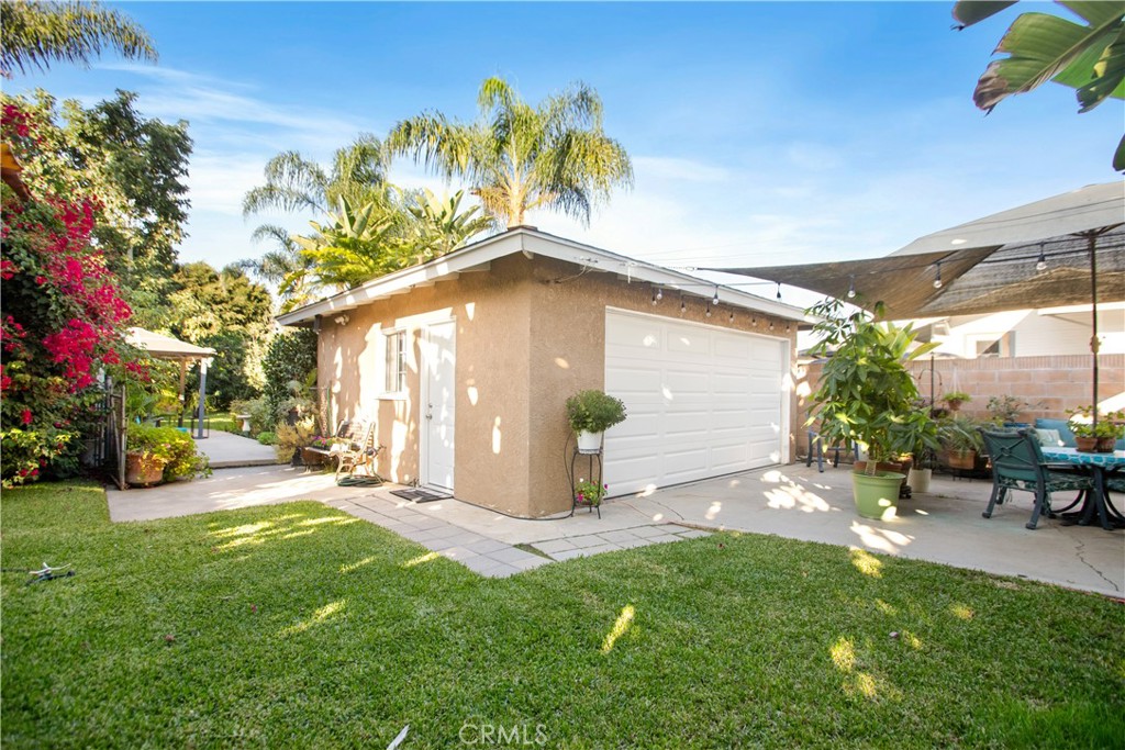 9253 Rose Street Bellflower, CA 90706 - Photo 25 of 36 a view of a house with backyard and sitting area