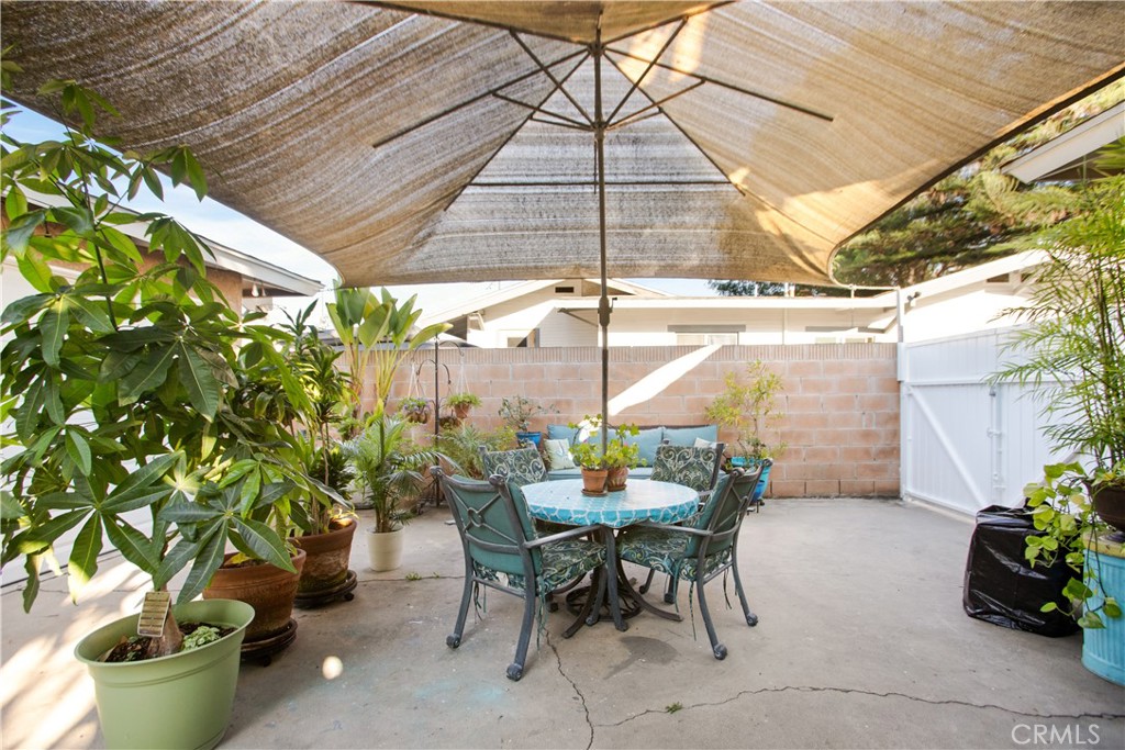 9253 Rose Street Bellflower, CA 90706 - Photo 26 of 36 a view of a tables and chairs in backyard