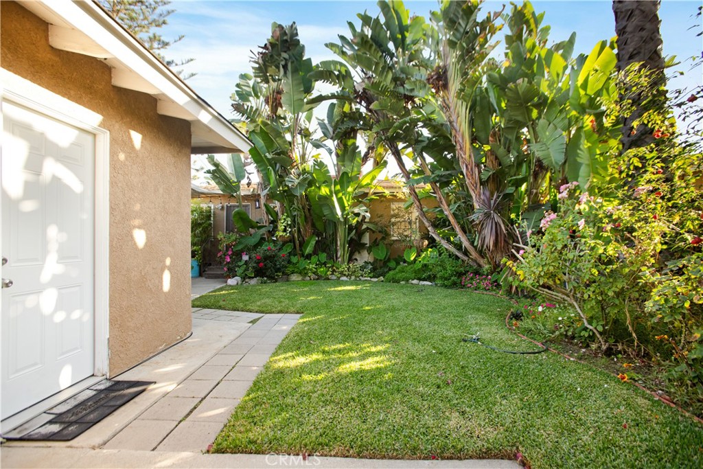 9253 Rose Street Bellflower, CA 90706 - Photo 27 of 36 a view of a back yard of the house