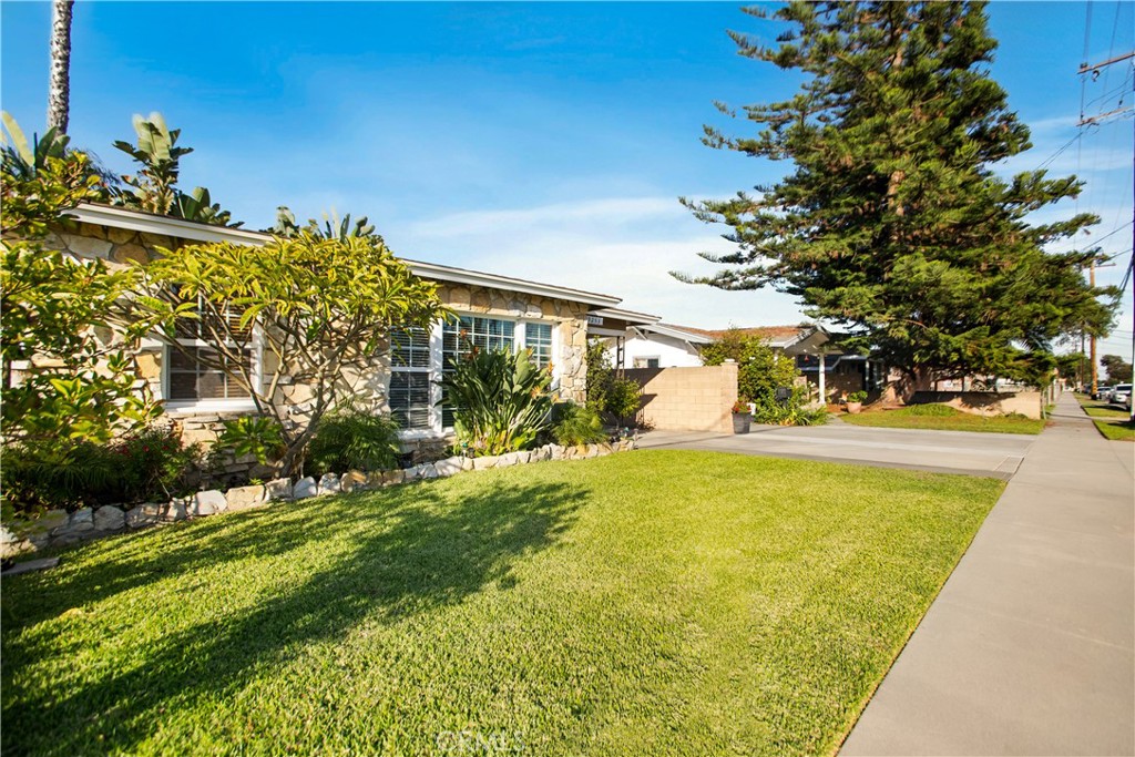 9253 Rose Street Bellflower, CA 90706 - Photo 3 of 36 a view of swimming pool with an outdoor space and seating area