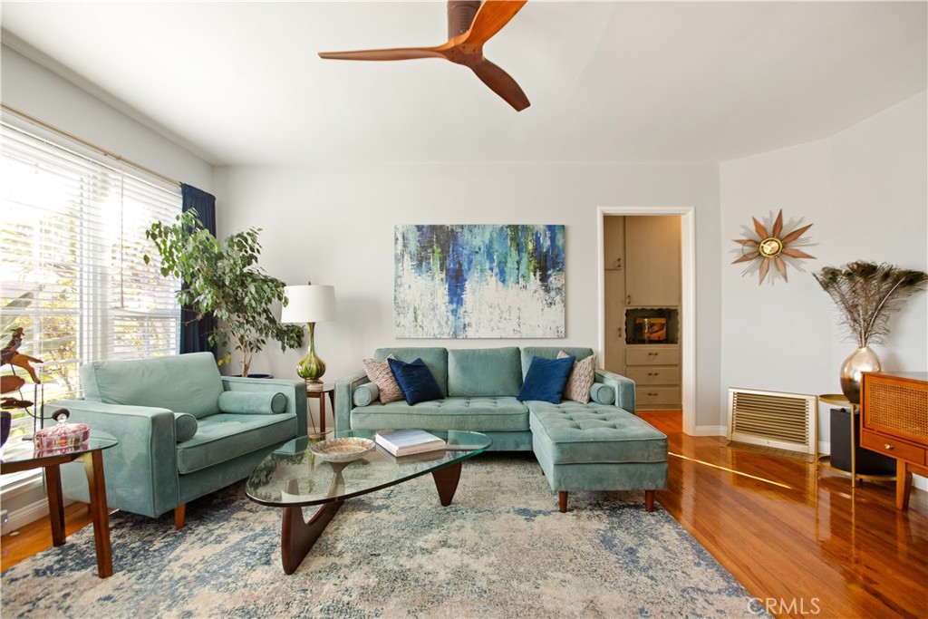 9253 Rose Street Bellflower, CA 90706 - Photo 6 of 36 a living room with furniture and a large window