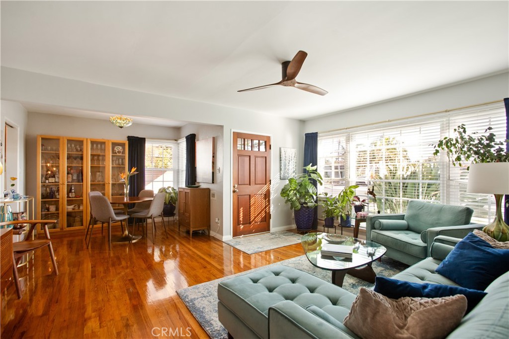 9253 Rose Street Bellflower, CA 90706 - Photo 8 of 36 a living room with furniture and a large window