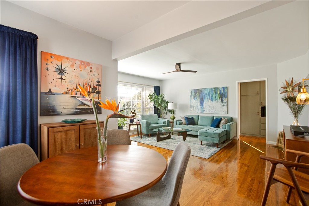 9253 Rose Street Bellflower, CA 90706 - Photo 9 of 36 a living room with dining room and wooden floor