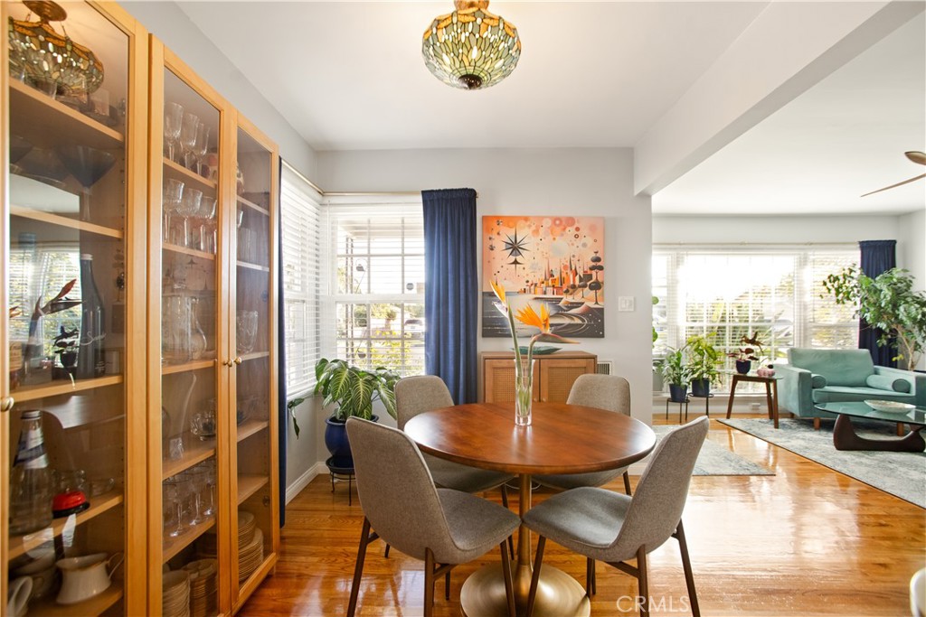 9253 Rose Street Bellflower, CA 90706 - Photo 10 of 36 a view of a dining room with furniture window and wooden floor