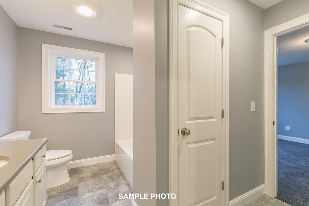 687 Boston Road Billerica, MA 01821 - Photo 18 of 20 a bathroom with a toilet sink and shower