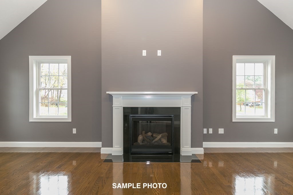 687 Boston Road Billerica, MA 01821 - Photo 6 of 20 a view of an empty room with a window and fireplace