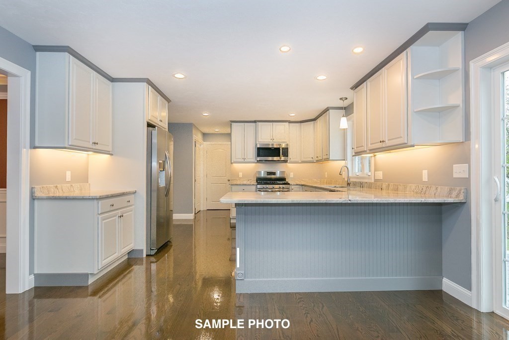 687 Boston Road Billerica, MA 01821 - Photo 7 of 20 a kitchen with refrigerator cabinets and a sink