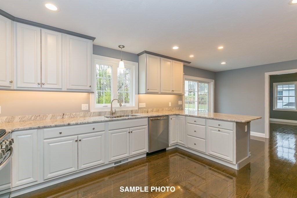 687 Boston Road Billerica, MA 01821 - Photo 9 of 20 a kitchen with granite countertop cabinets sink and window