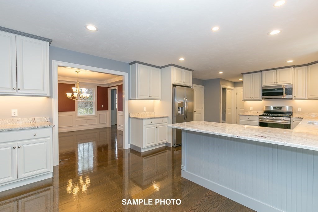 687 Boston Road Billerica, MA 01821 - Photo 10 of 20 a kitchen with counter top space cabinets and stainless steel appliances