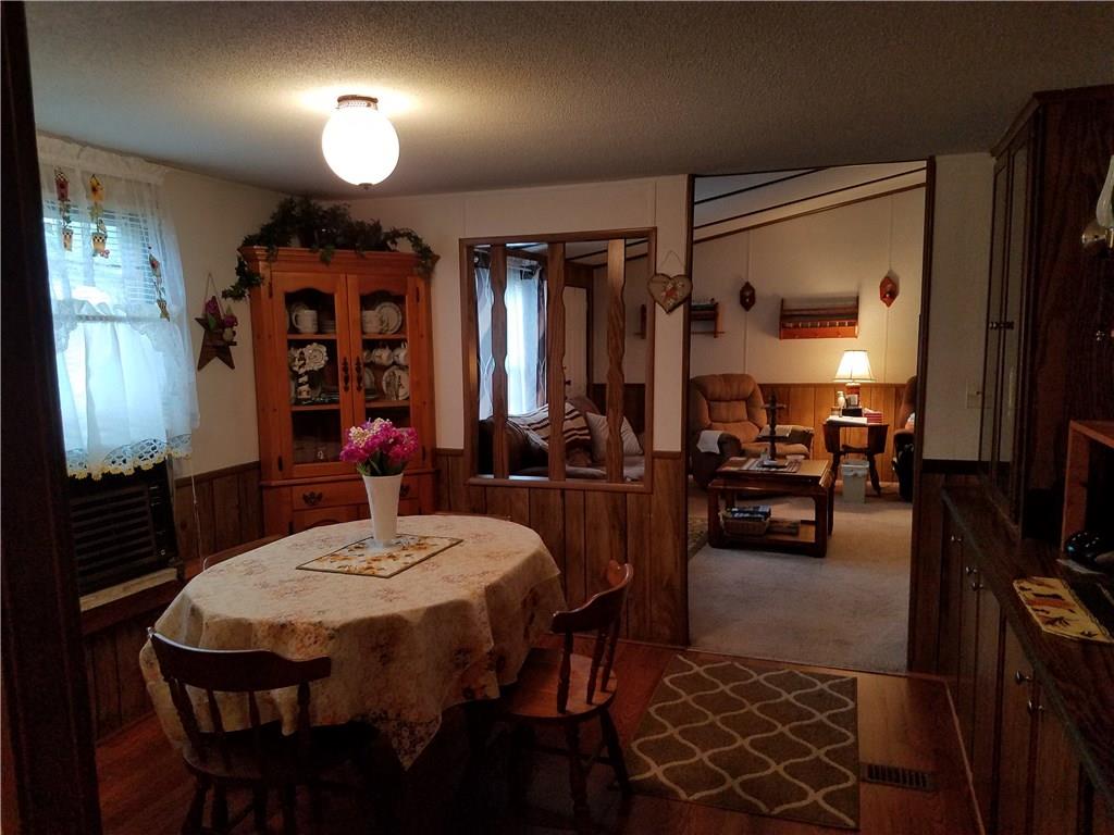 852 Robb Road New Florence, PA 15944 - Photo 12 of 24 Dining room with peak view of living room. A/C unit and hutch included on left.