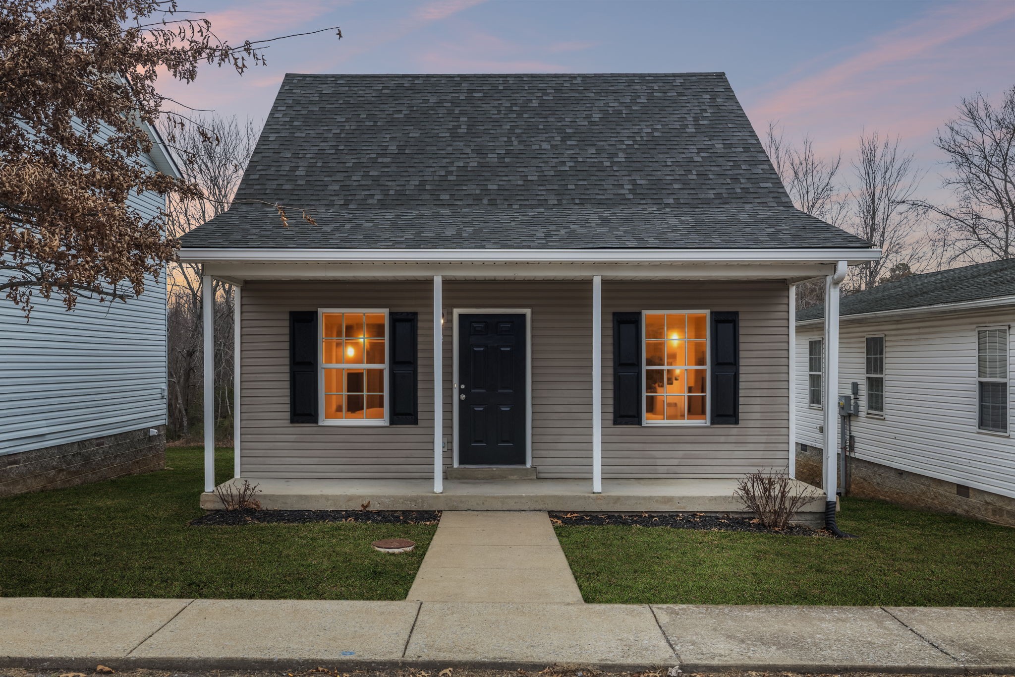 a front view of a house with a yard