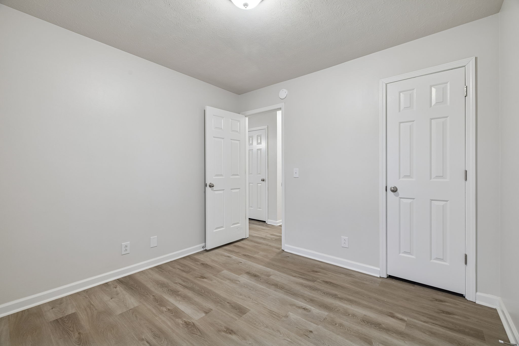 2607 Landrum Court, Unit 15 Springfield, TN 37172 - Photo 11 of 38 a view of an empty room with wooden floor