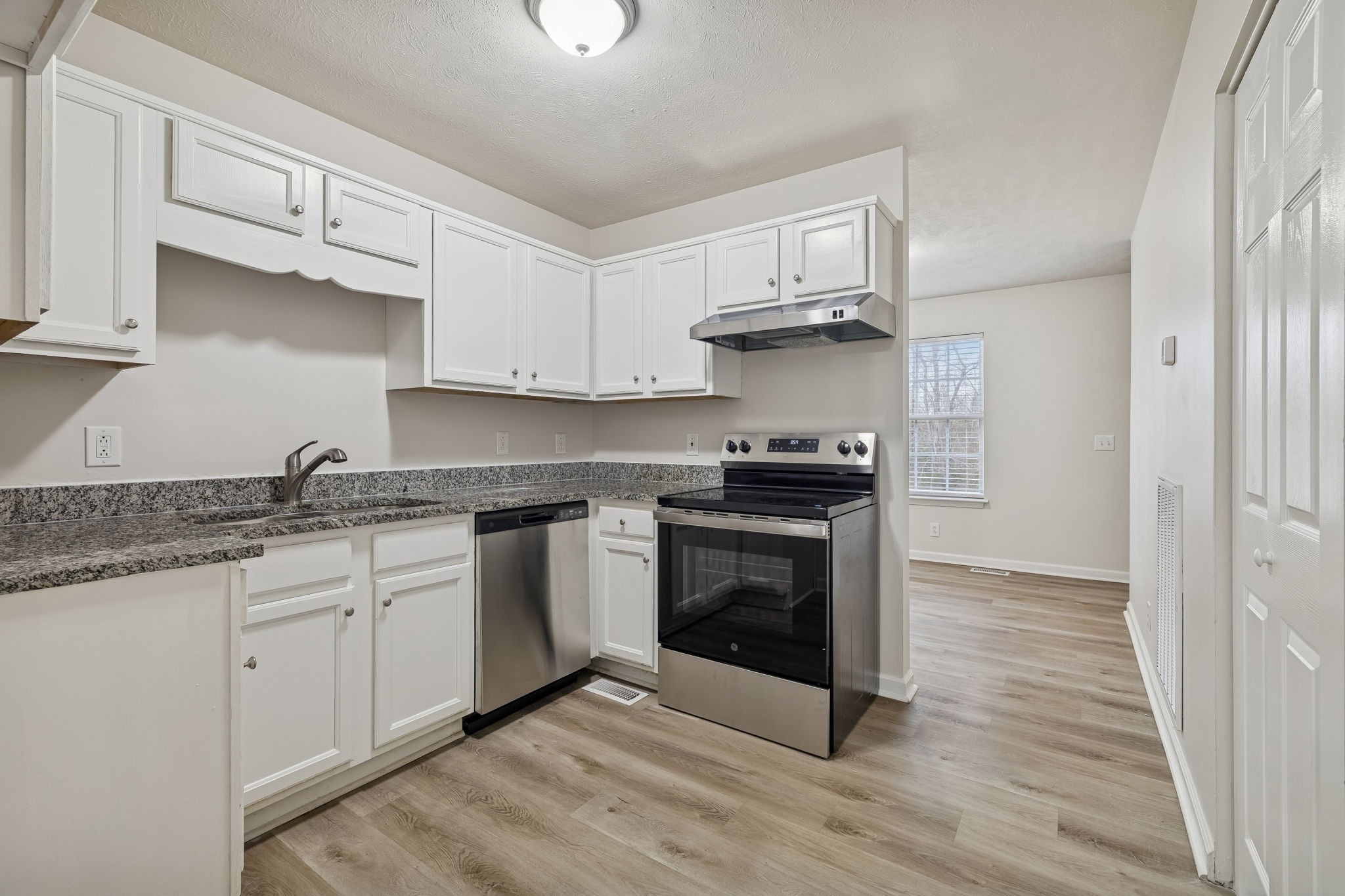 2607 Landrum Court, Unit 15 Springfield, TN 37172 - Photo 16 of 38 a kitchen with granite countertop a sink cabinets and stainless steel appliances