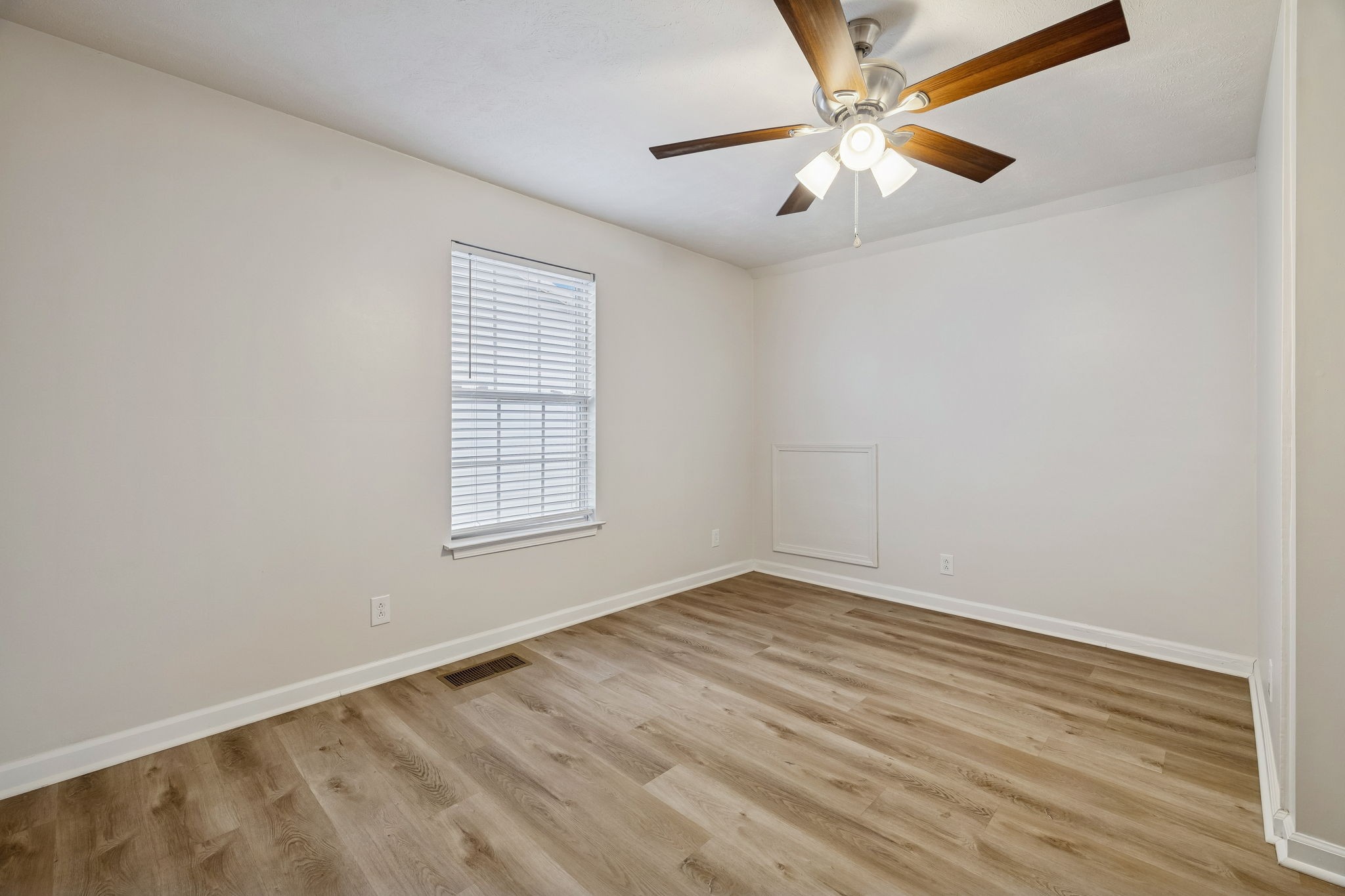 2607 Landrum Court, Unit 15 Springfield, TN 37172 - Photo 28 of 38 wooden floor in an empty room with a window
