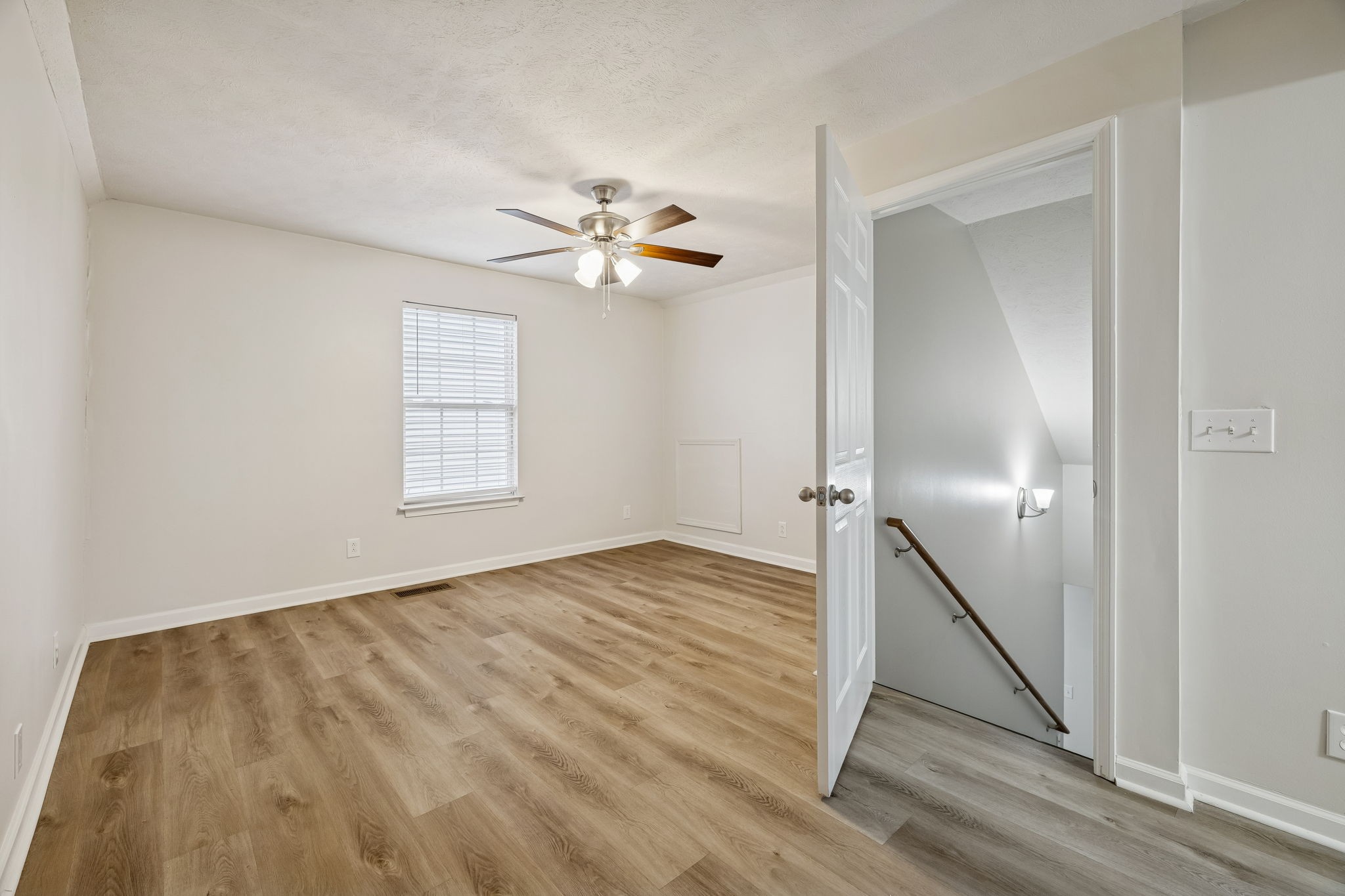2607 Landrum Court, Unit 15 Springfield, TN 37172 - Photo 29 of 38 wooden floor in an empty room with a window