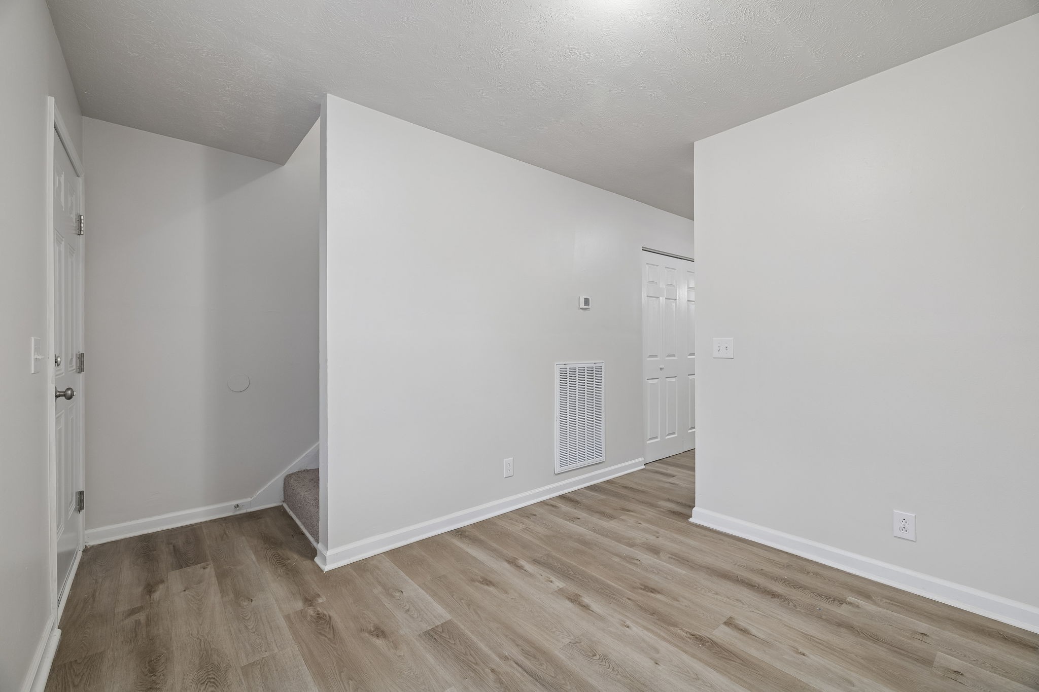 2607 Landrum Court, Unit 15 Springfield, TN 37172 - Photo 30 of 38 a view of an empty room with wooden floor
