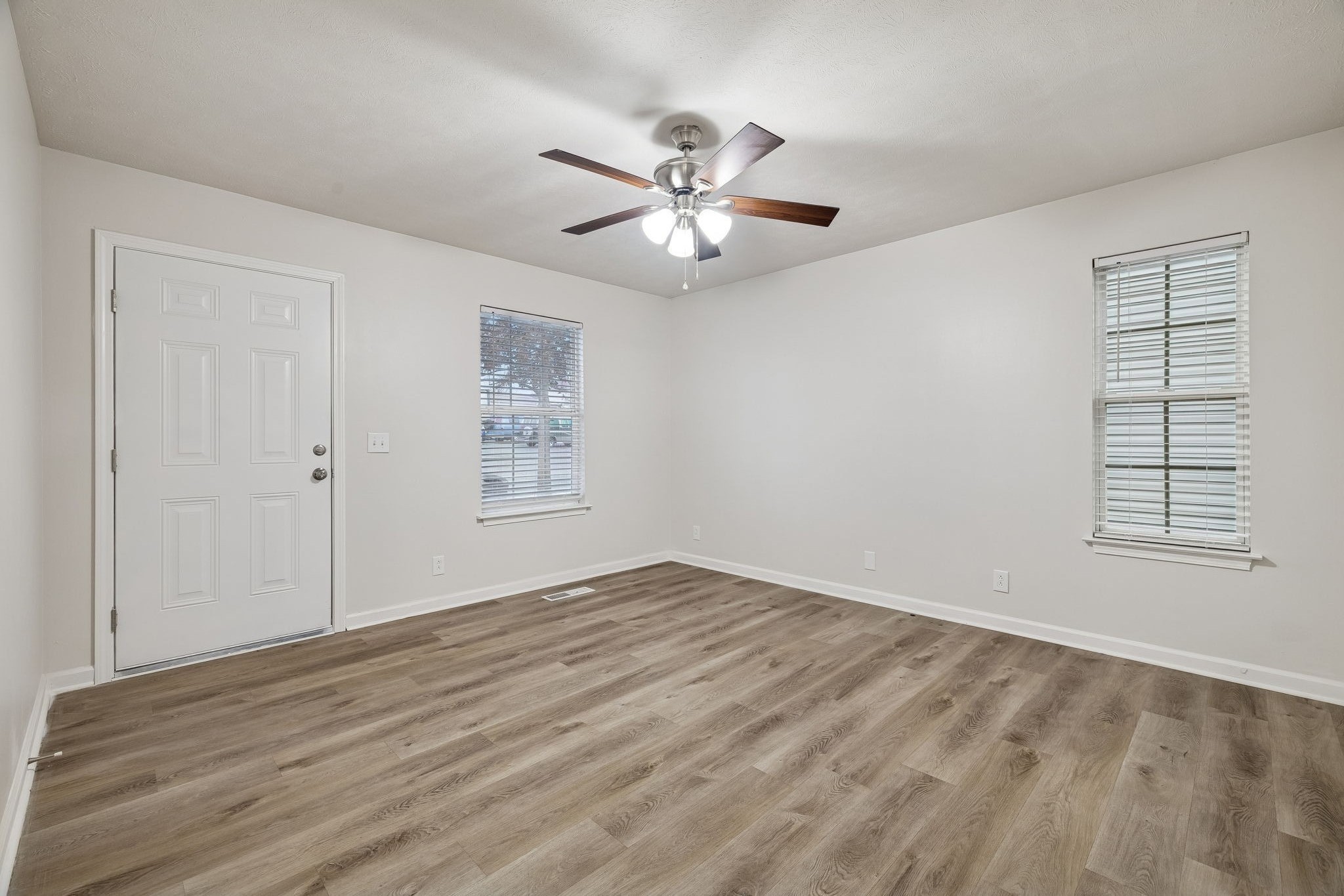 2607 Landrum Court, Unit 15 Springfield, TN 37172 - Photo 7 of 38 wooden floor in an empty room with a window