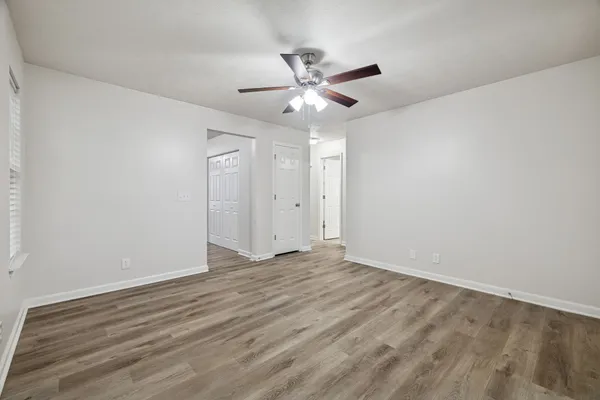 a kitchen with granite countertop a sink cabinets and stainless steel appliances
