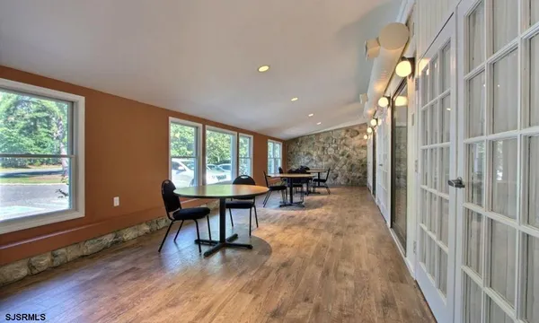 a view of a room with furniture window and wooden floor