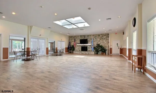a view of a room with gym equipment and a large window