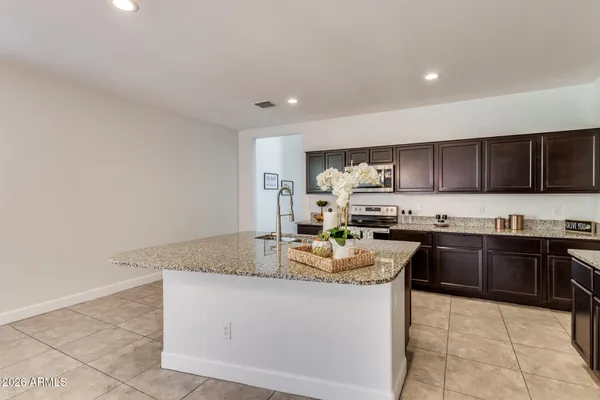 a bathroom with a sink and vanity