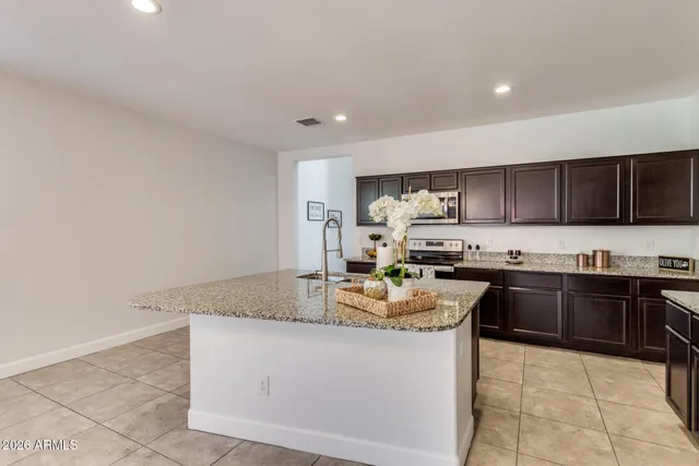 a bathroom with a sink and vanity