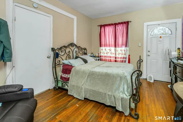 a bathroom with a sink and mirror with shower