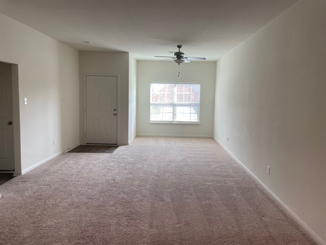 18741 Speculator Lane Elgin, TX 78621 - Photo 14 of 28 a view of an empty room with a window