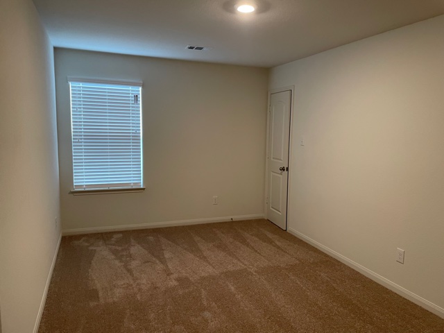 18741 Speculator Lane Elgin, TX 78621 - Photo 23 of 28 an empty room with a window