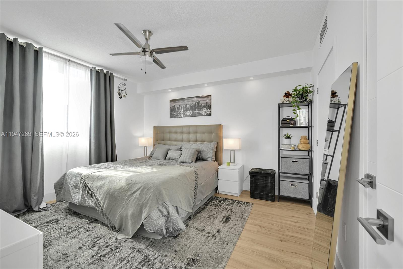 275 Northeast 18th Street, Unit 1207 Miami, FL 33132 - Photo 15 of 31 a bedroom with a large bed and a window