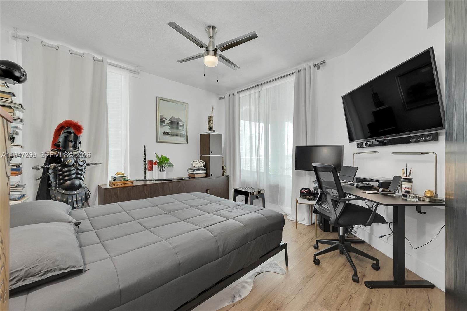 275 Northeast 18th Street, Unit 1207 Miami, FL 33132 - Photo 24 of 31 a bedroom with a workspace