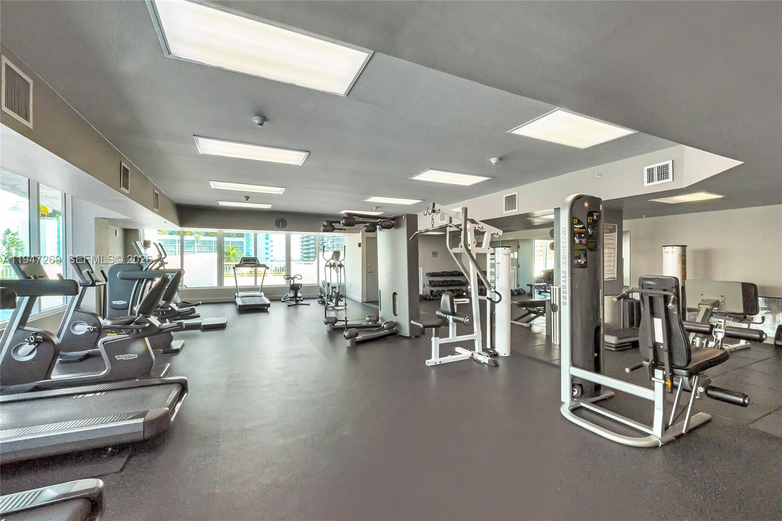 275 Northeast 18th Street, Unit 1207 Miami, FL 33132 - Photo 27 of 31 a view of a room with gym equipment
