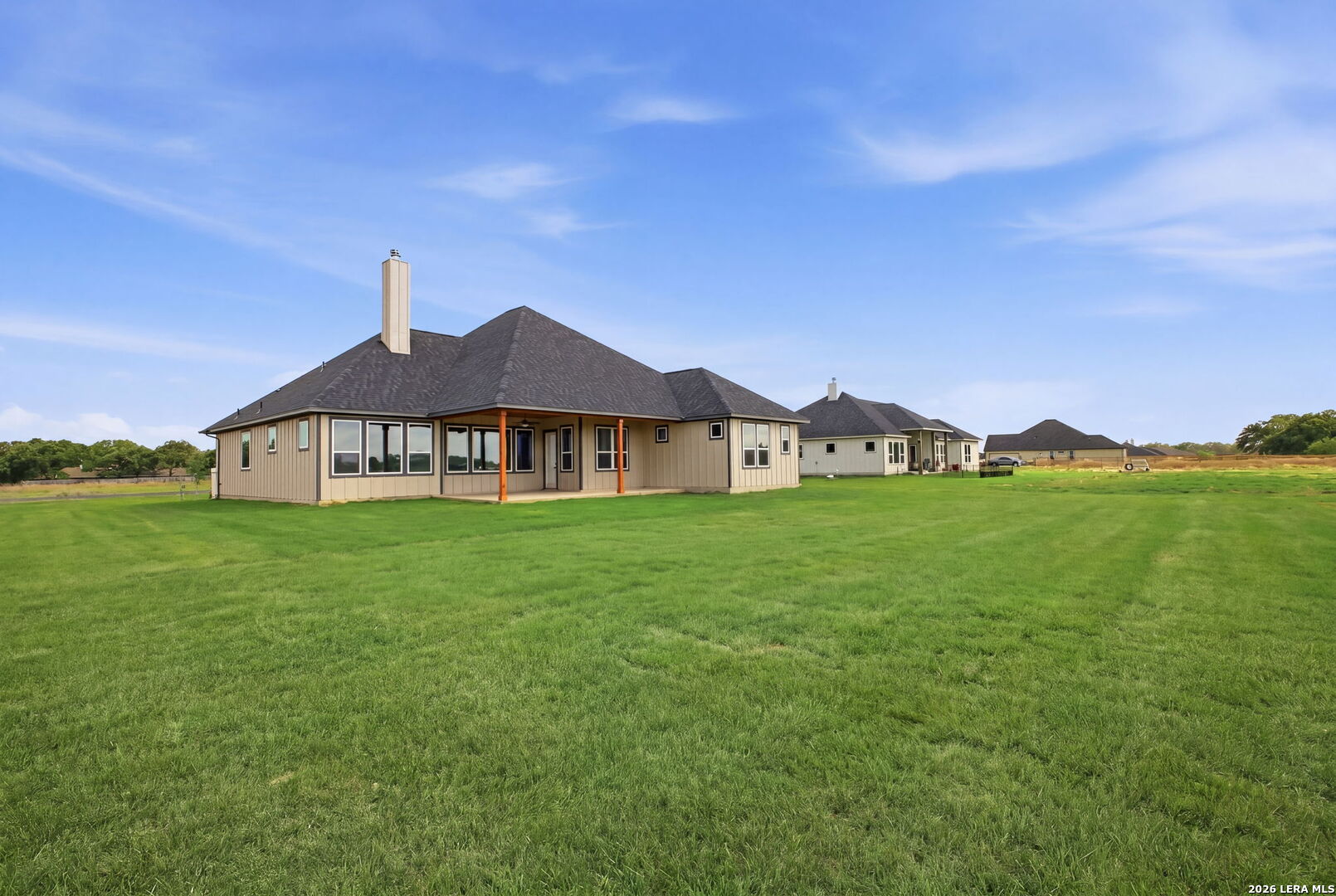 171 Pradera Ridge Drive Floresville, TX 78114 - Photo 12 of 18 a view of a big house with a big yard