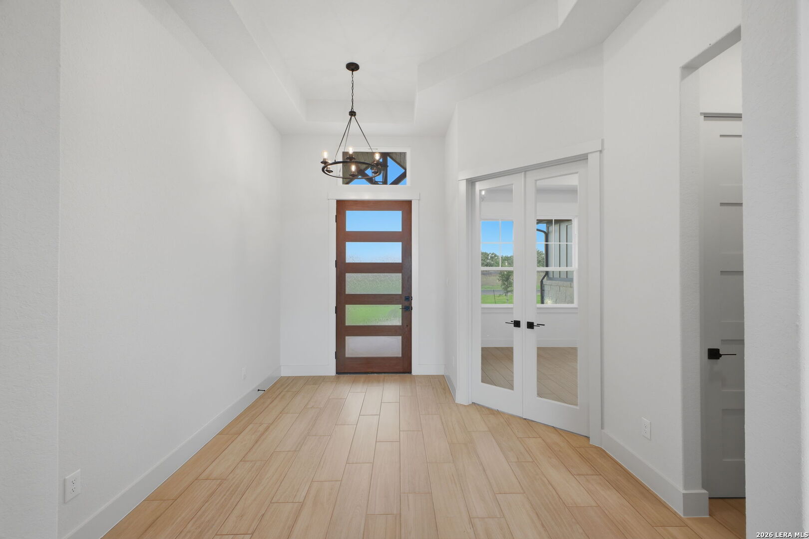 171 Pradera Ridge Drive Floresville, TX 78114 - Photo 15 of 18 a view of empty room with wooden floor