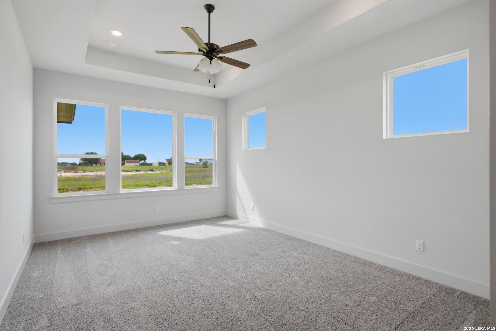 171 Pradera Ridge Drive Floresville, TX 78114 - Photo 16 of 18 a view of a livingroom with a ceiling fan and window