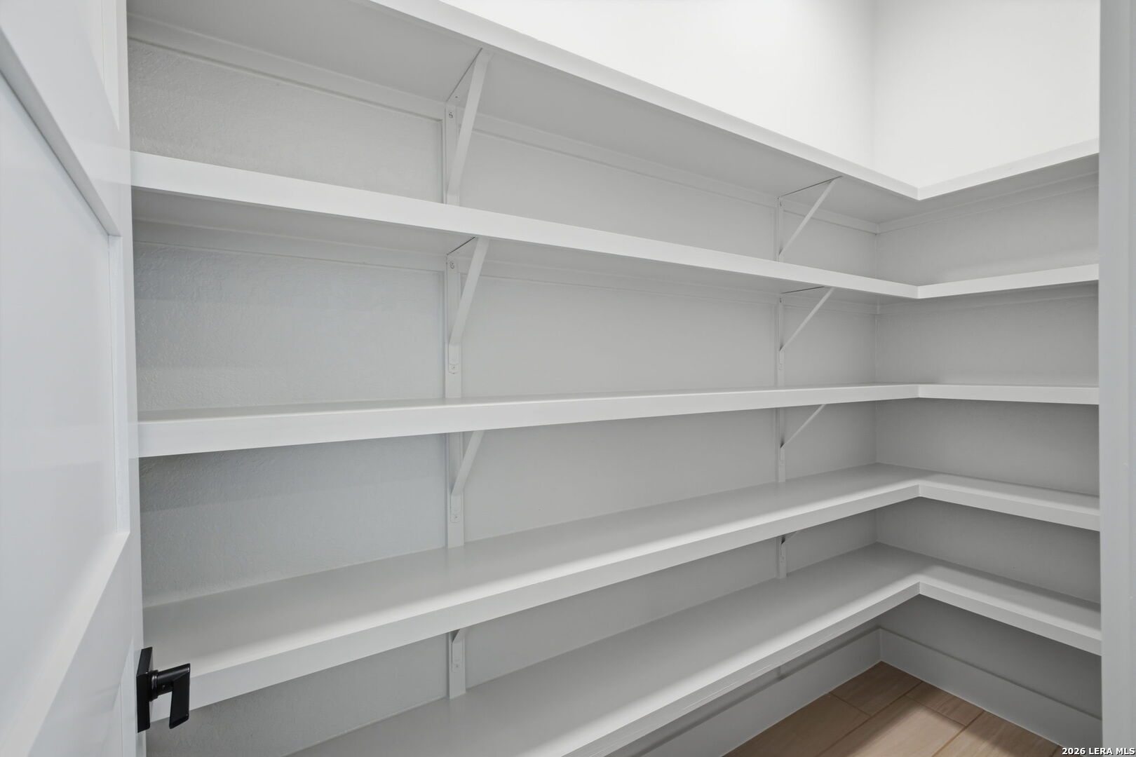 171 Pradera Ridge Drive Floresville, TX 78114 - Photo 5 of 18 a view of walk in closet with empty racks