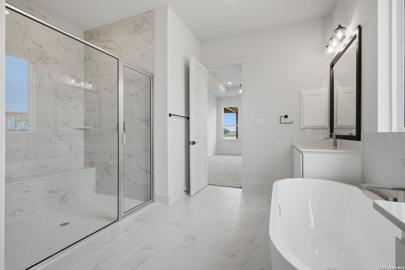 171 Pradera Ridge Drive Floresville, TX 78114 - Photo 7 of 18 a bathroom with a bathtub and a shower
