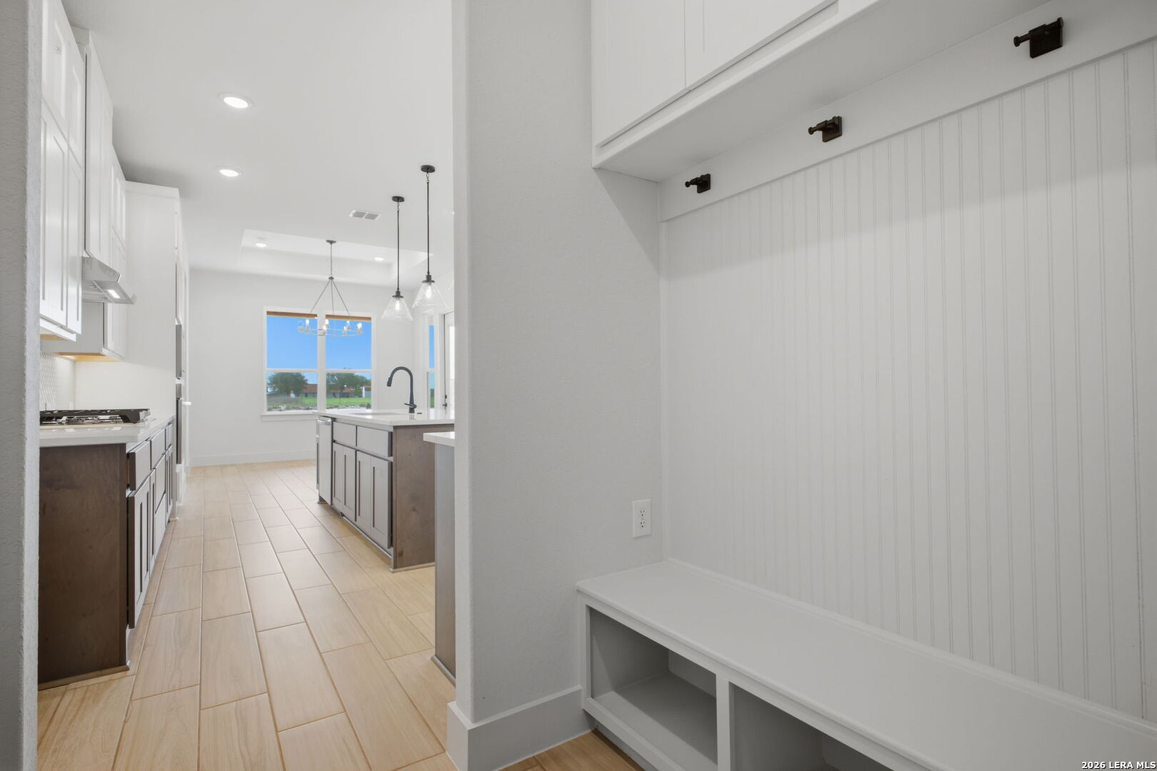 171 Pradera Ridge Drive Floresville, TX 78114 - Photo 10 of 18 a kitchen with cabinets and a stove