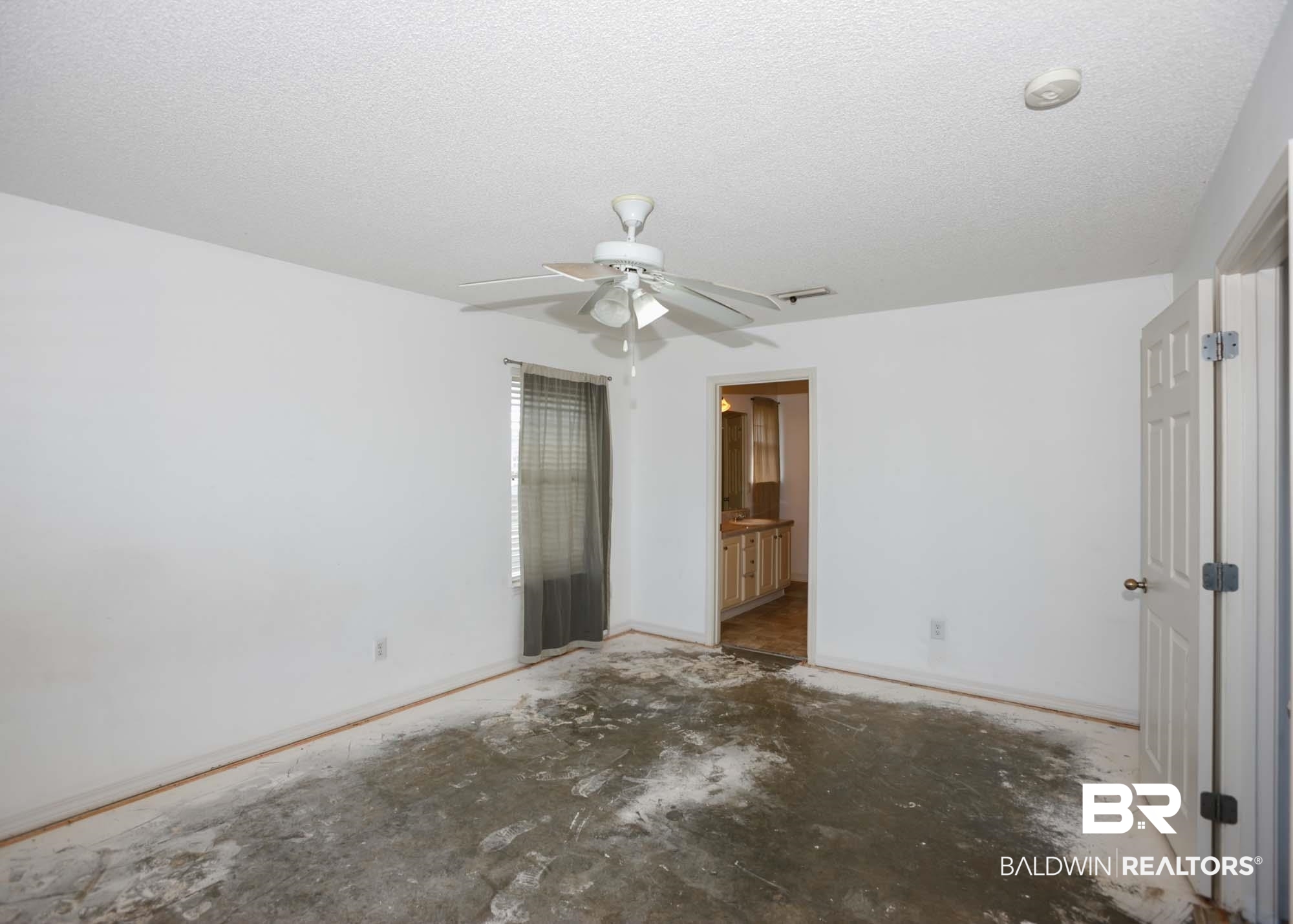 2530 Ashburn Lane Foley, AL 36535 - Photo 22 of 46 Unfurnished bedroom featuring a textured ceiling, ensuite bath, and ceiling fan